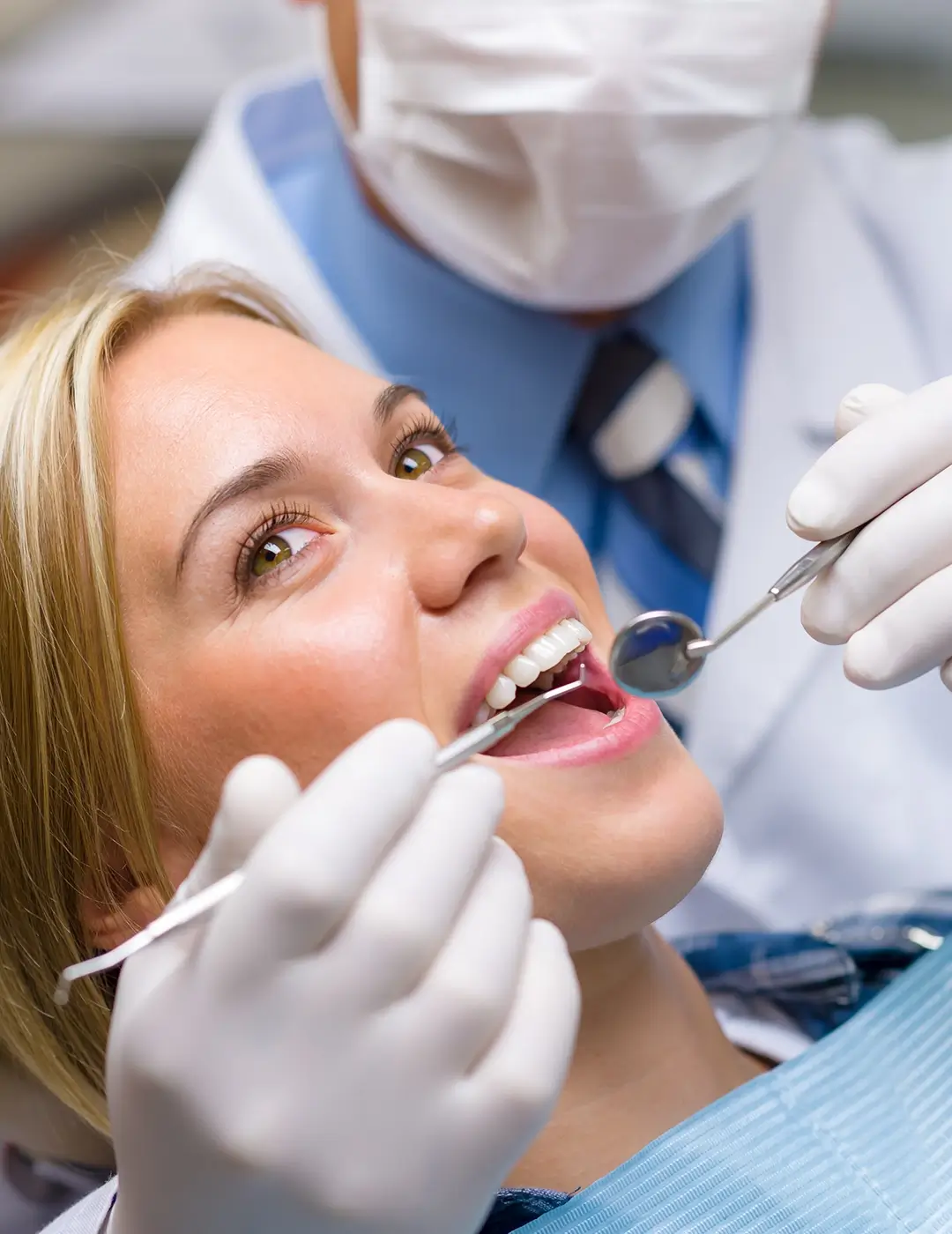 Dr. Baker examining a patient's teeth during a routine checkup